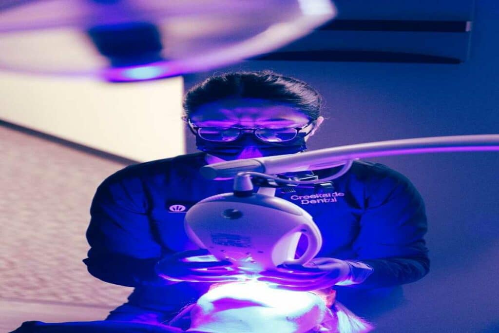 A dentist performing a procedure to patient Spotted Fox Digital