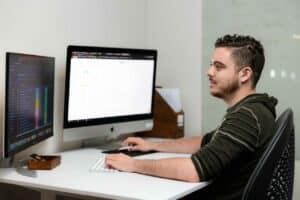 SEO Specialist working in the computer Spotted Fox Digital
